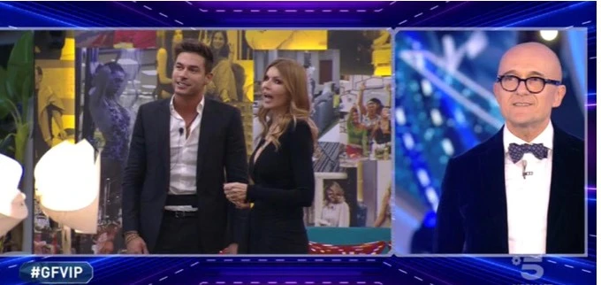 Grande Fratello vip, Signorini spiazza Andrea Denver: "C'è una persona nella casa...". Imbarazzo: è una ex?