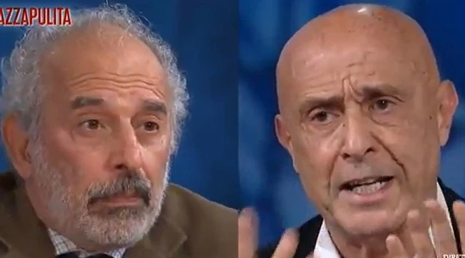 Piazzapulita, rissa tra Marco Minniti e Gad Lerner: "Cosa ride? Perché è così sciocco?"