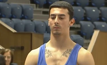 Gimnast Bonicelli v komi po padcu z obeh strani