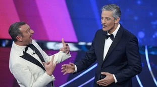 John Travolta "spacca" Amadeus e Fiorello? Attenzione alle loro parole