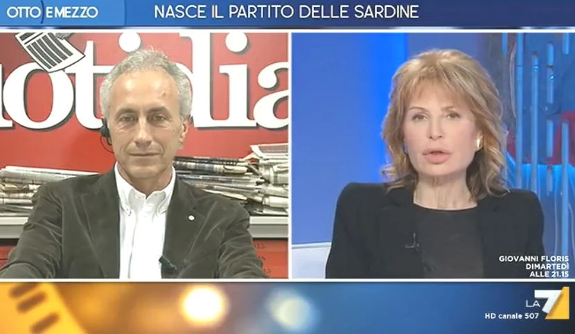 Otto e mezzo, Lilli Gruber a Marco Travaglio: "Cogli*** o...? Scusate per il francese". Insulto alle Sardine