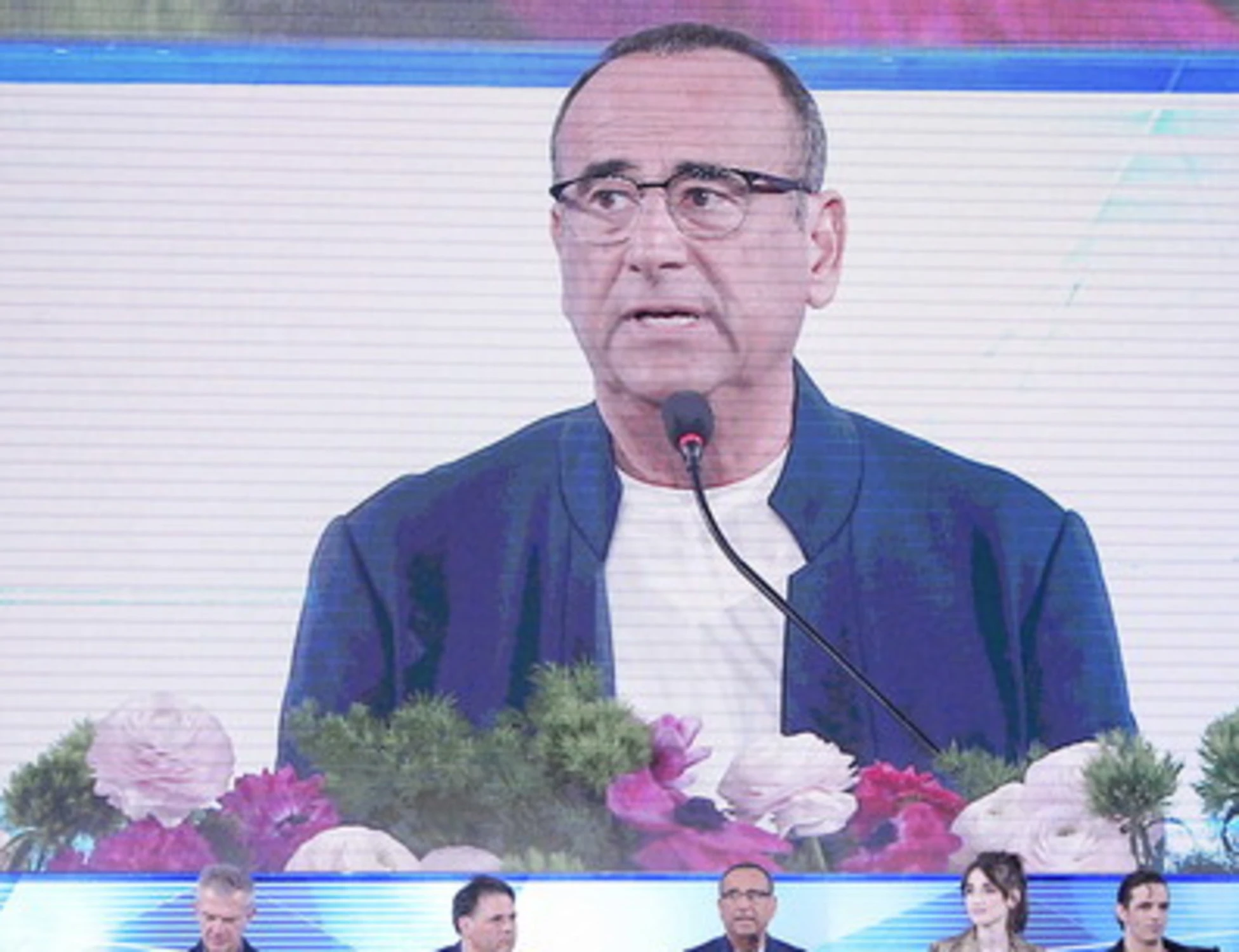 Sanremo 2026, Carlo Conti sotto assedio: disabili, donne e Russia. Chi c'è dietro?